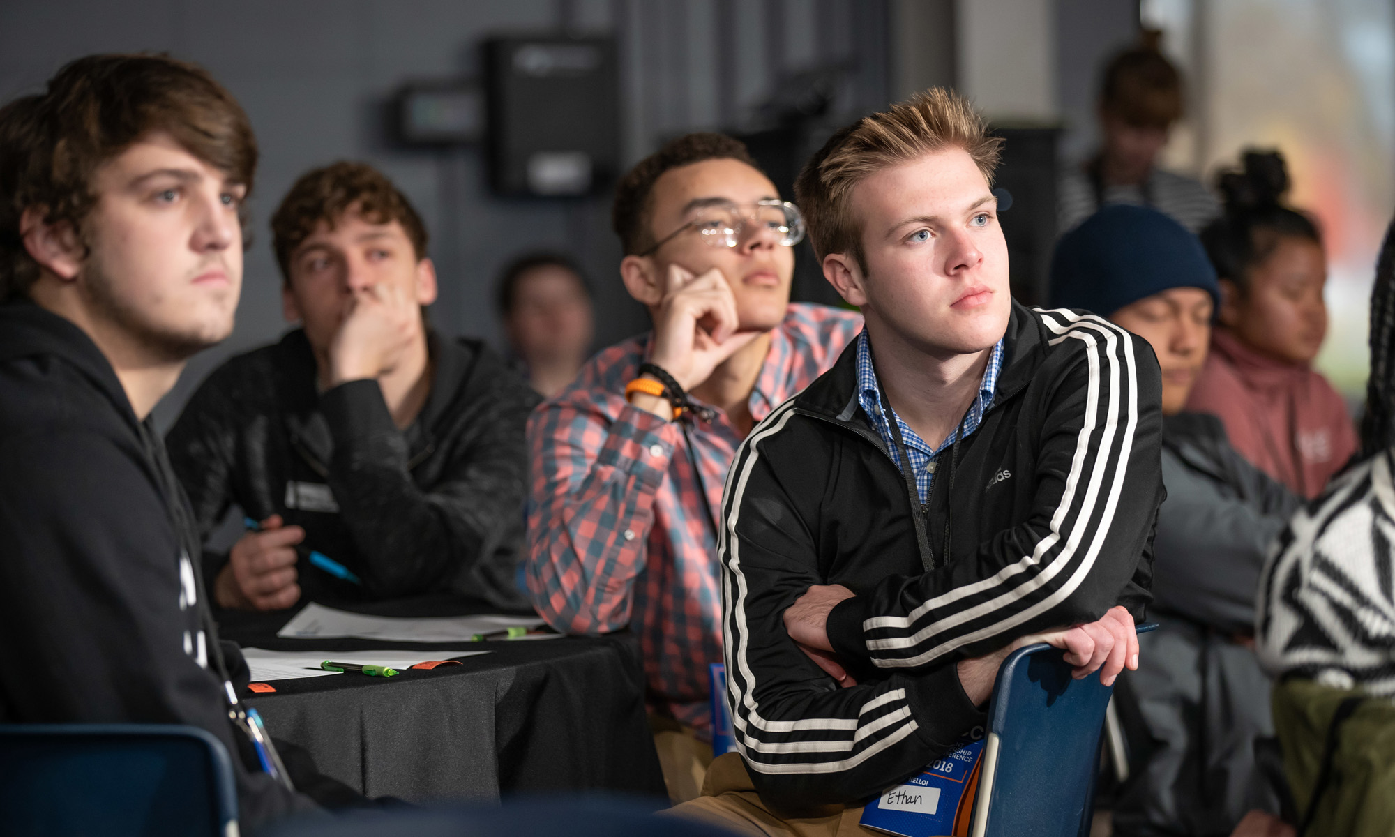 Group of students listening to classroom teachings