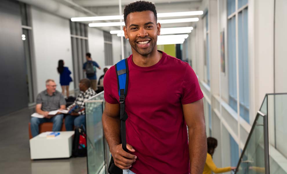 Happy-student-in-hallway