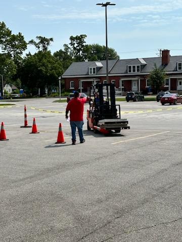 student operating forklift