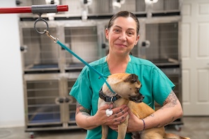 Woman holding dog