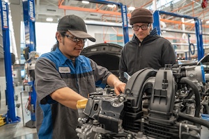 Students working on engine