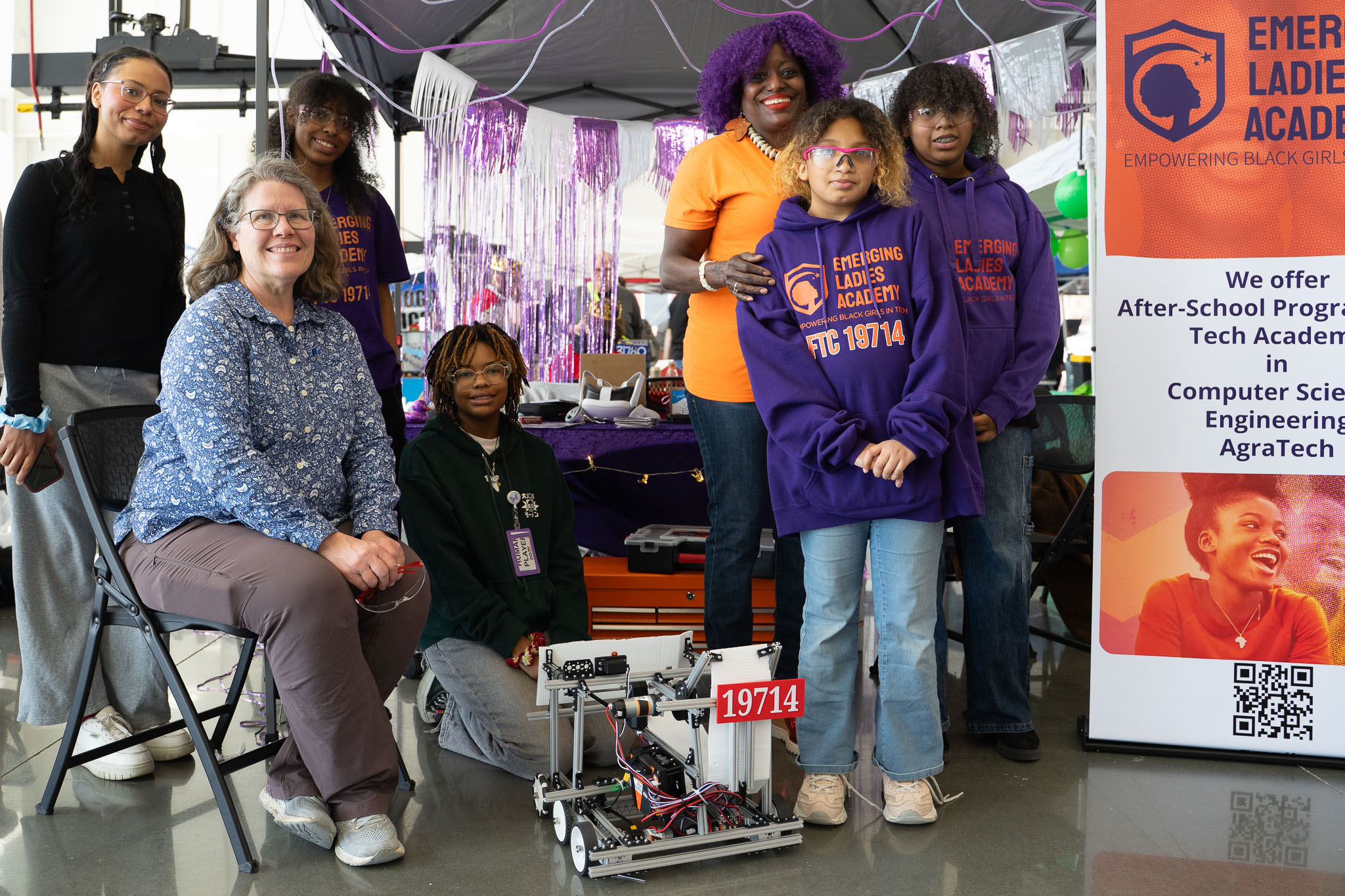 Students and coaches with the Emerging Ladies Academy robotics team 