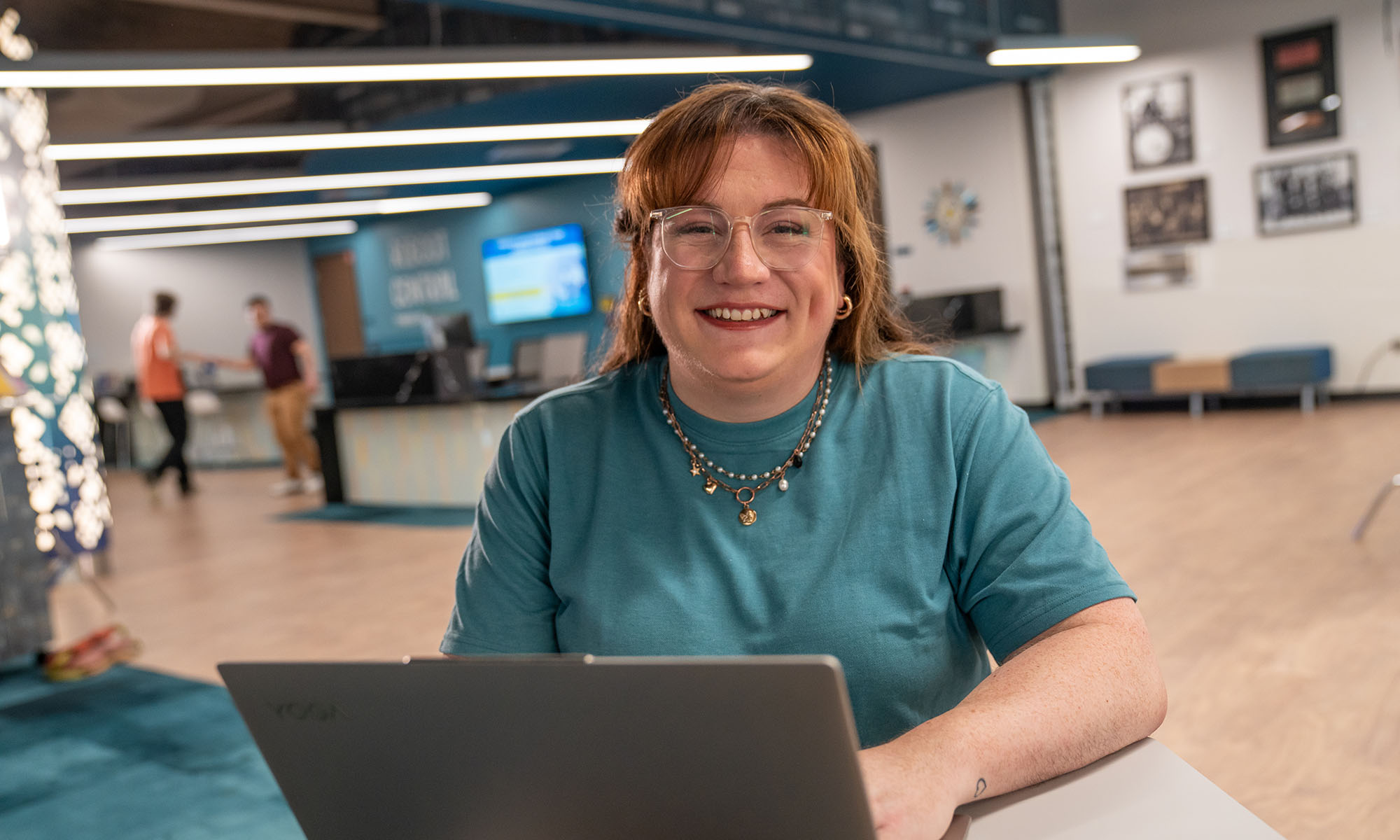 Smiling student on laptop