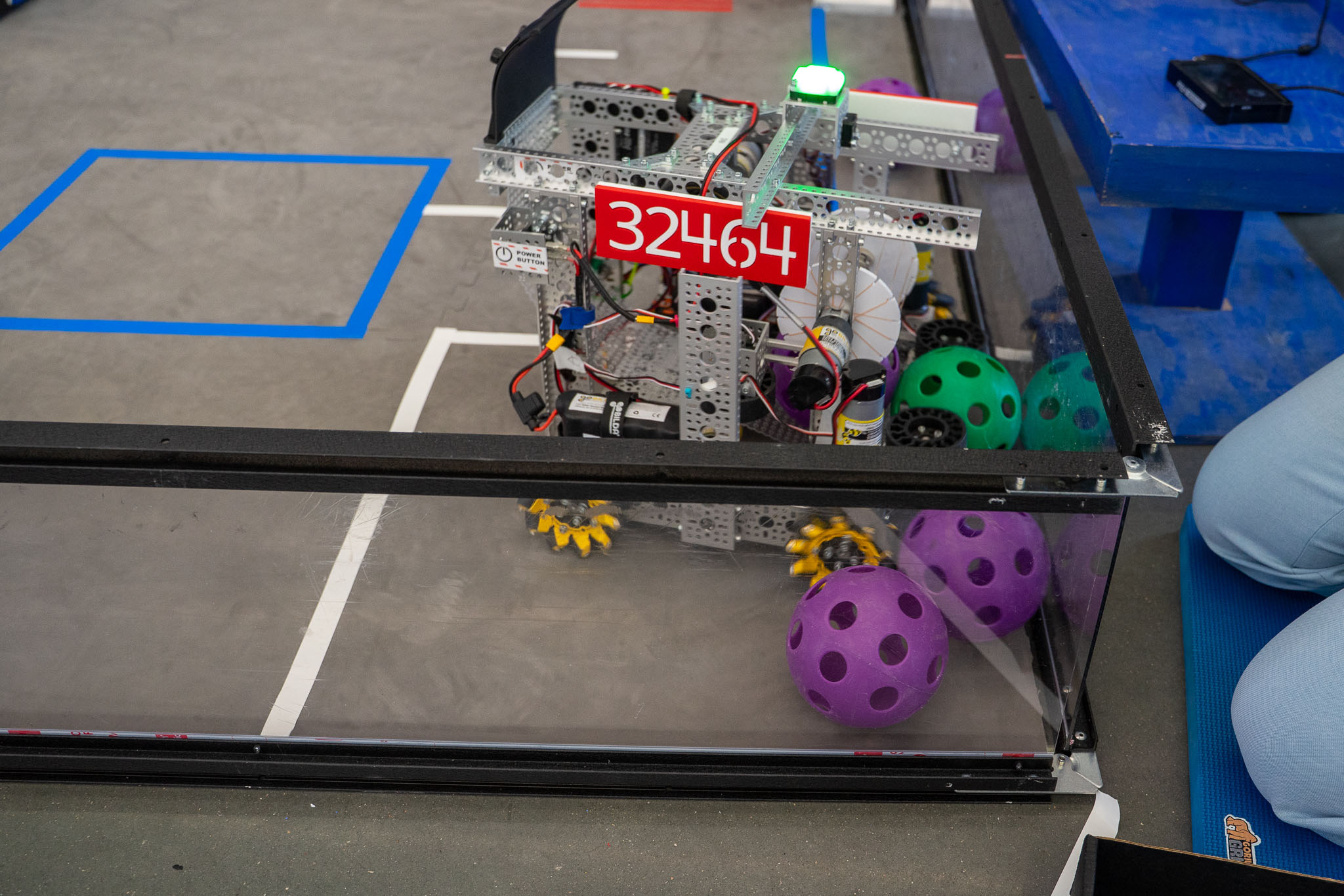 A robot intakes balls on the playing field at the 2026 FTC Nebraska Championship